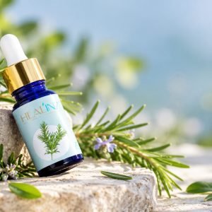 Spanish Rosemary Essential Oil bottle with botanicals